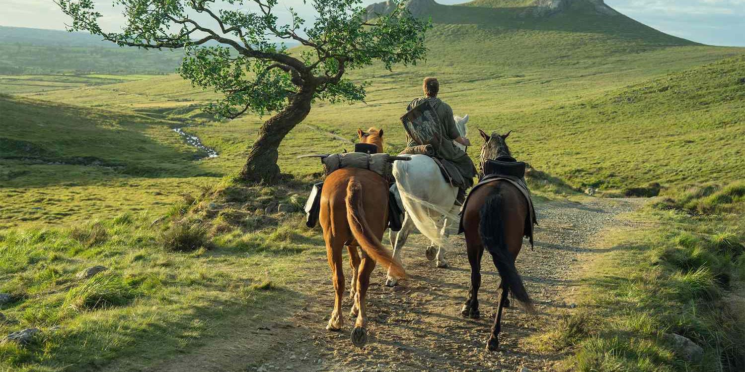 Dunk riding a horse, alongside two other horses, on a path in Westeros on a Knight of the Seven Kingdoms