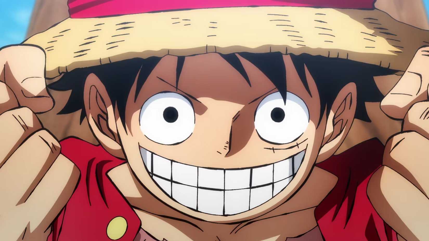 One Piece Monkey D. Luffy sourit avec des dents et serre les poings