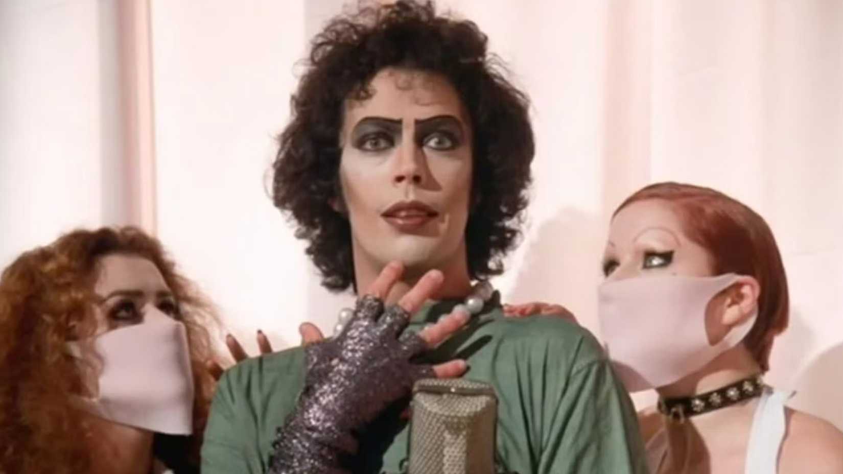 Frank-N-Furter stands between Magenta and Columbia in Rocky Horror Picture Show