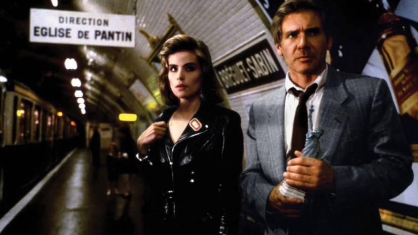 Richard Walker and Michelle standing in a train station in Frantic 1988