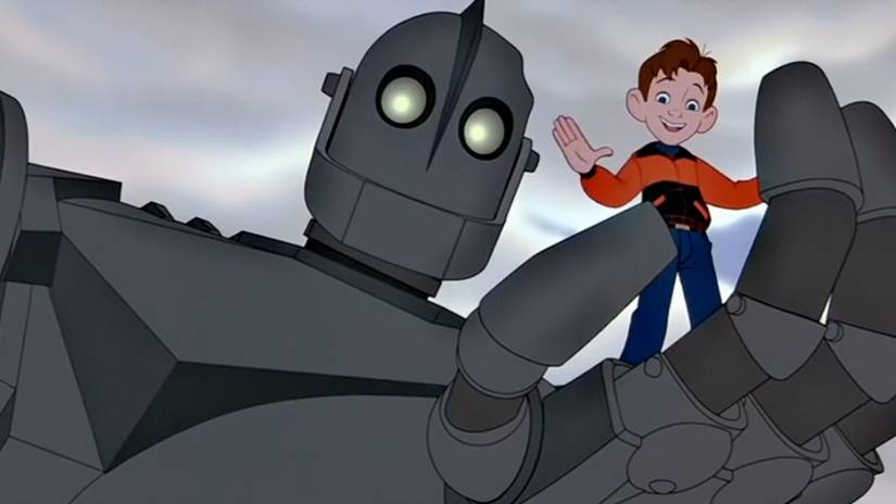 The Iron Giant holds Hogarth in his hand in The Iron Giant