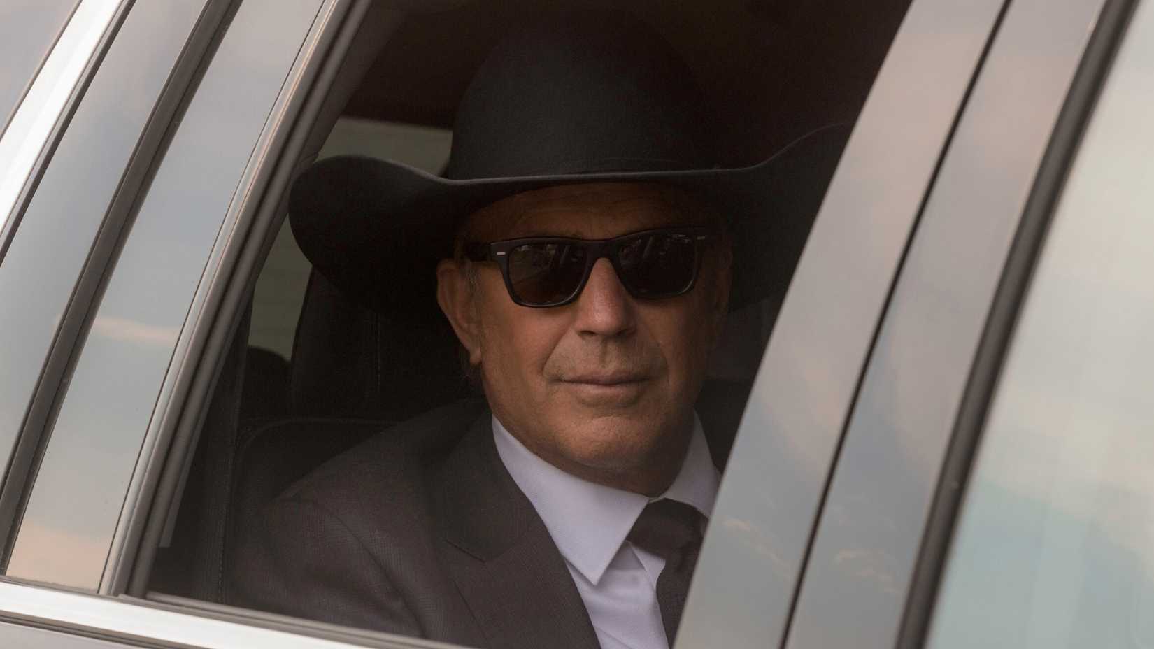 John Dutton (Kevin Costner) looks out the window of his limosine in Yellowstone