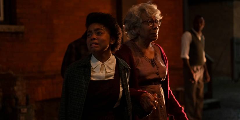 A young girl cries with her grandmother in HBO's IT Welcome to Derry Season 1 - Episode 2