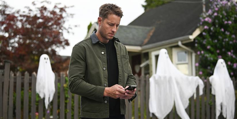 Justin Hartley as Colter checking his phone in Tracker 'First Fire'