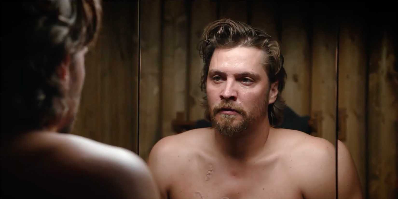 Luke Grimes as Kayce Dutton looking in the mirror in Y Marshals official trailer