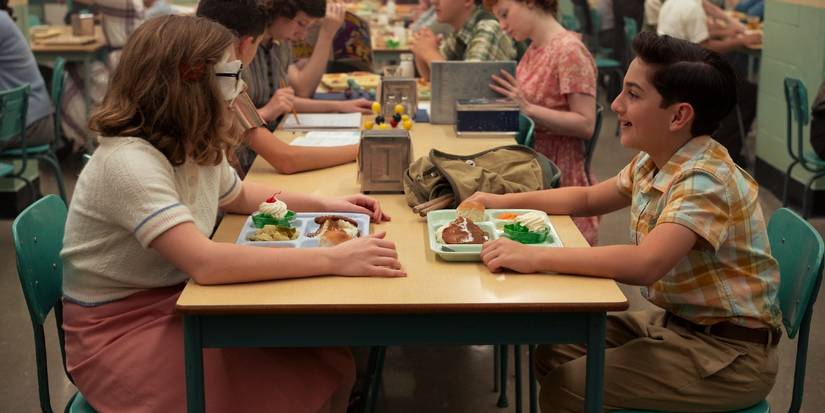 Marge sits at lunch with Rich while wearing an eye patch in Welcome to Derry