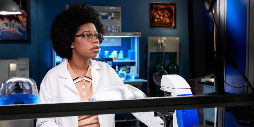 Forensic Scientist Kasie Hines looks at a computer to investigate a murder in NCIS Season 23 'The Sound and the Fury'