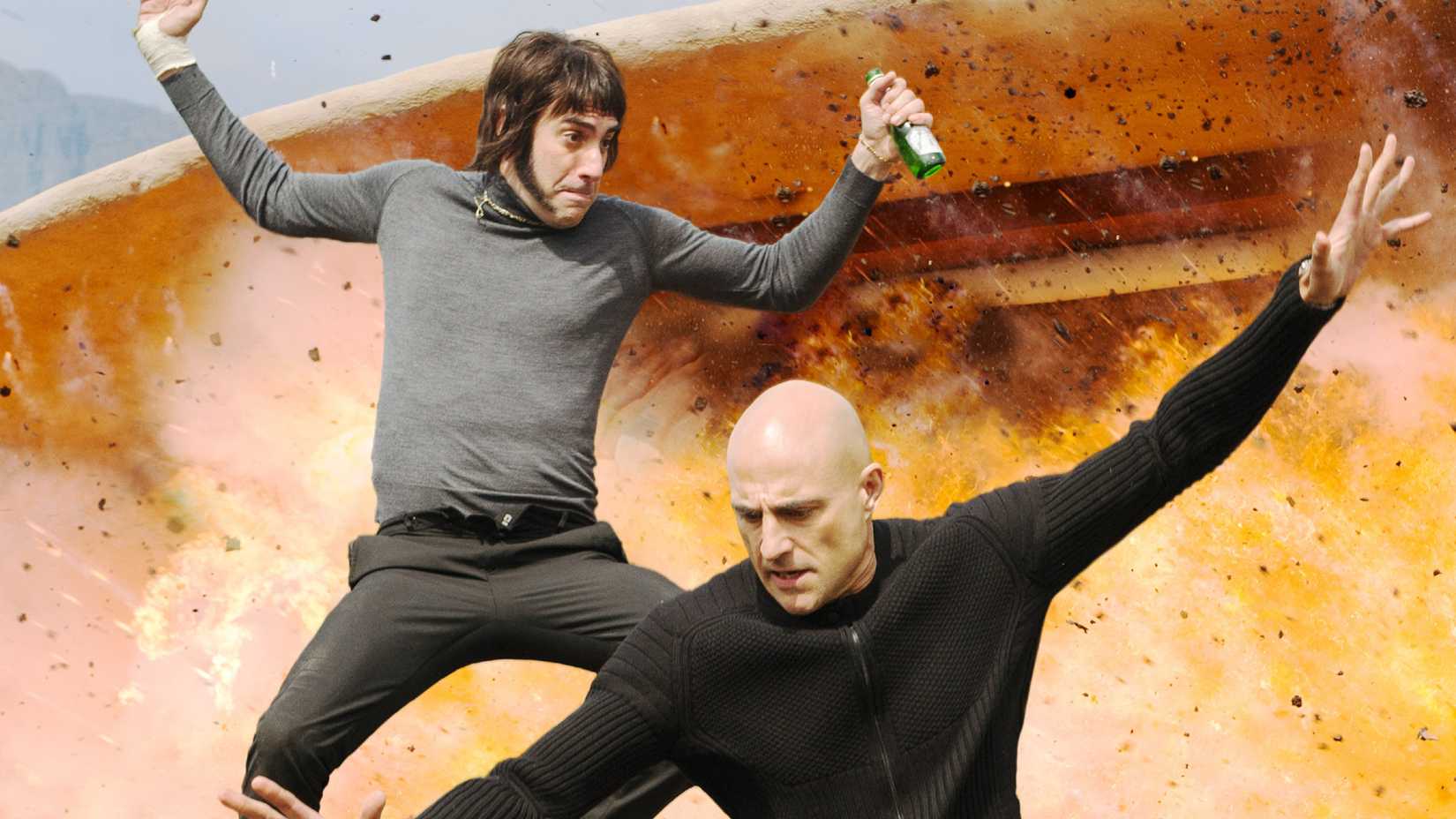 Mark Strong and Sacha Baron Cohen escape an explosion in The Brothers Grimsby