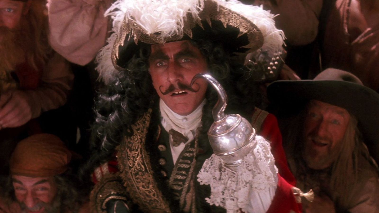 Captain Hook looks up as his pirates stand around him