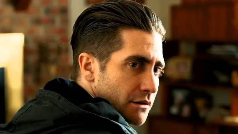 Jake Gyllenhaal as Loki looking over his shoulder in Prisoners