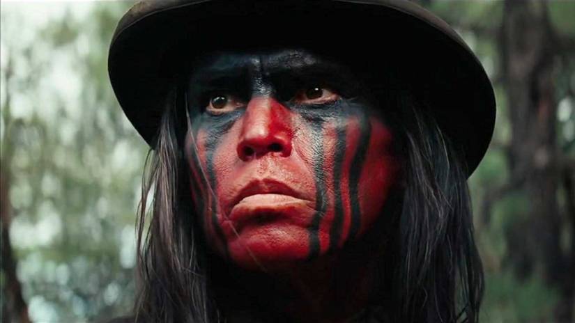 A Comanche warrior with war paint on his face in Hostiles