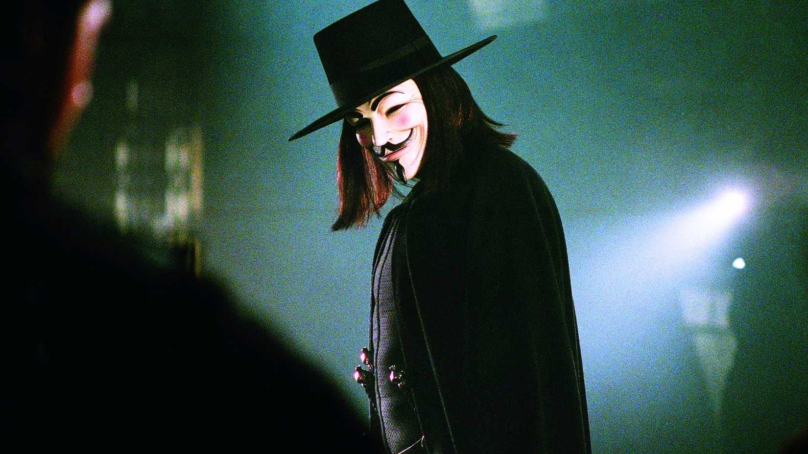 V standing in profile in hazy light from V for Vendetta