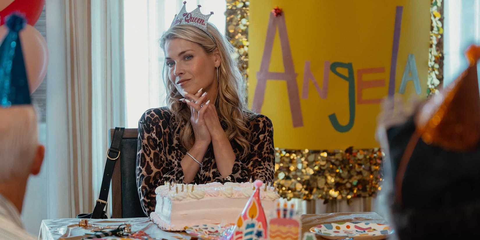 Ali Larter as Angela Norris clasps her hands and looks on at her party guests at her birthday party at the old folks home in Landman