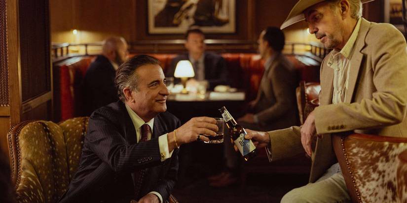 Andy Garcia as Danny Morrell aka Gallino and Billy Bob Thornton as Tommy Norris in clinking their drinks together Landman Season 2