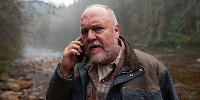 Brent Sexton as Keaton on the phone by a river in Tracker 'Good Trouble'