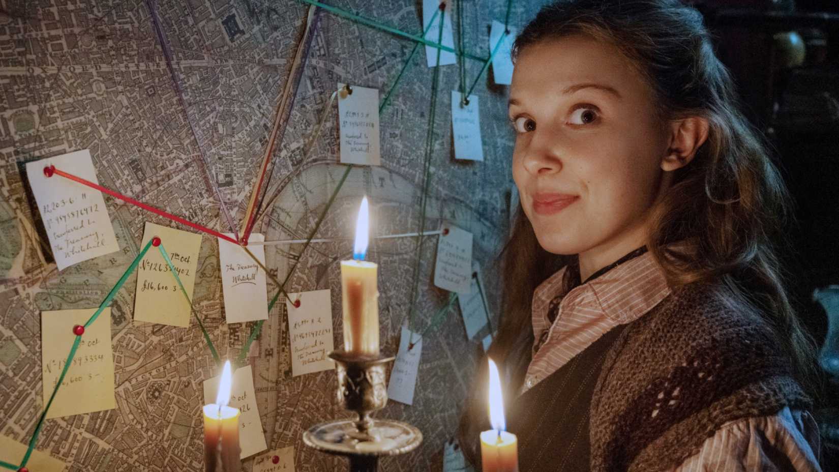 Enola Holmes (Millie Bobby Brown) investigates a mystery