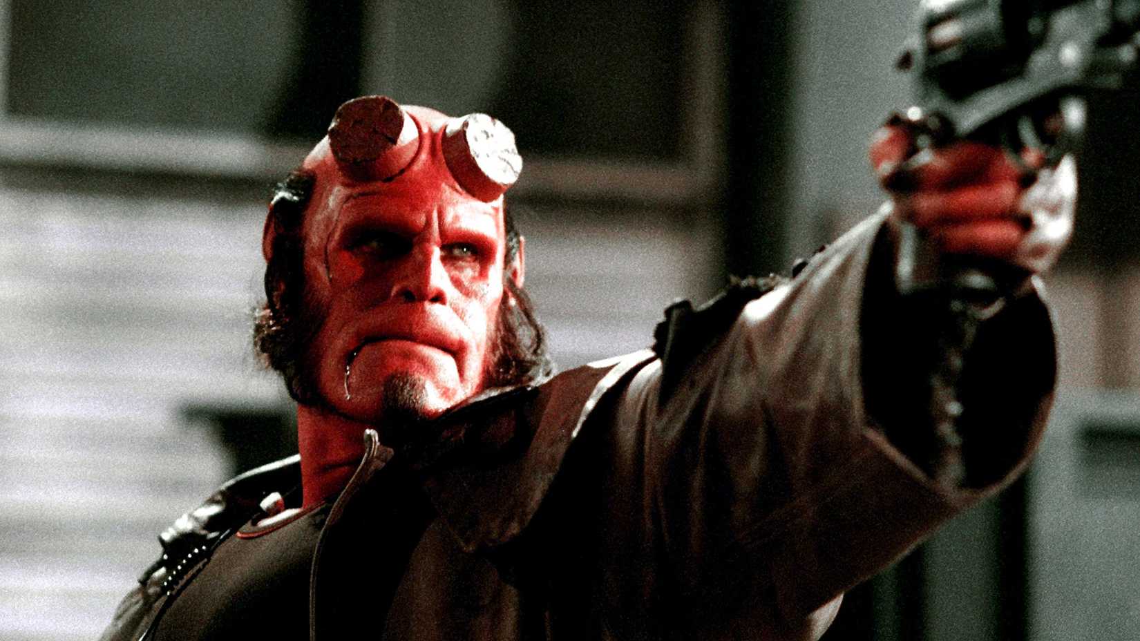 Hellboy (Ron Perlman) points a gun in Hellboy II: The Golden Army