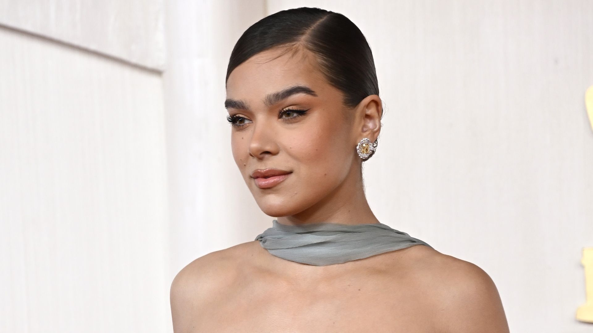 Hailee Steinfeld looks slightly to the side