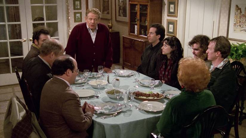 Jerry Stiller as Frank Costanza leading the Festivus table in Seinfeld