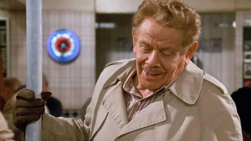 Jerry Stiller in Seinfeld holding the aluminum Festivus Pole in the diner