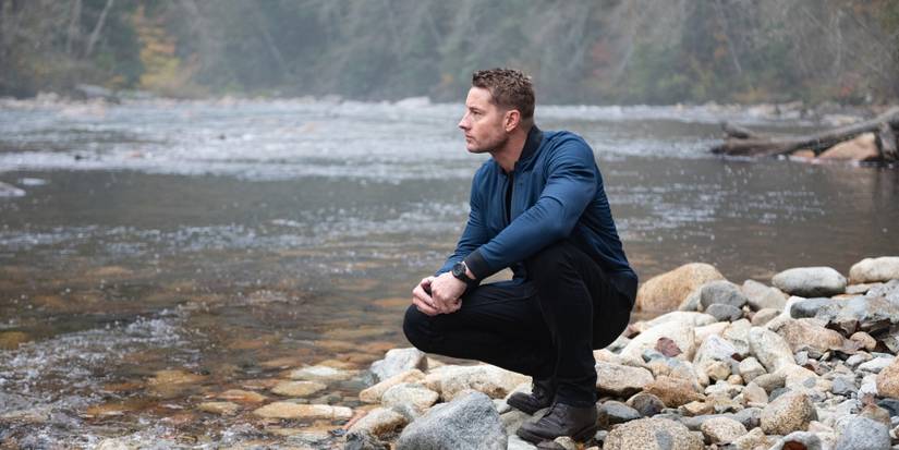 Justin Hartley as Colter by the river's edge in Tracker 'Good Trouble'