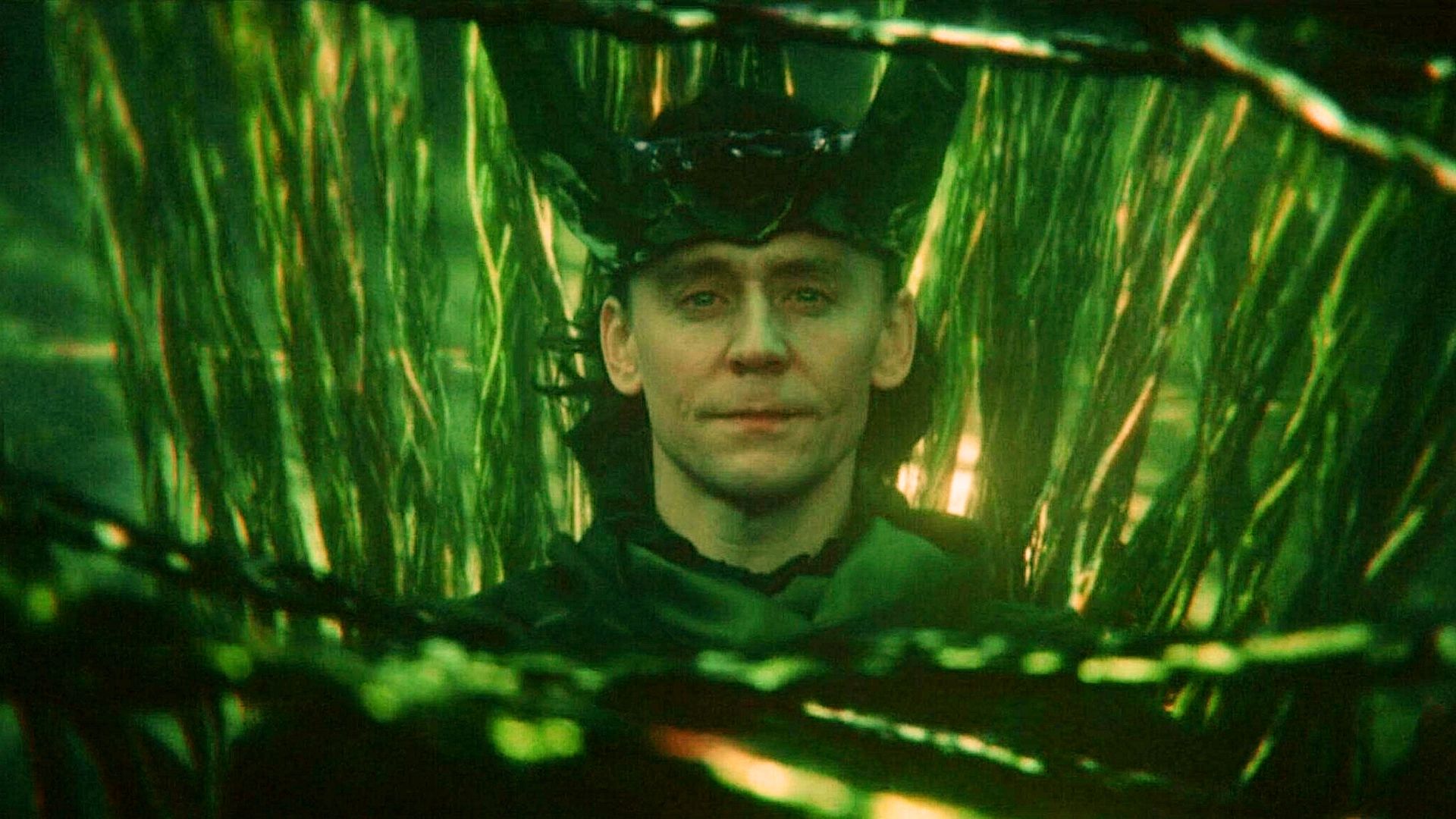 Loki at the center of the multiverse represented as green ropes from Loki series