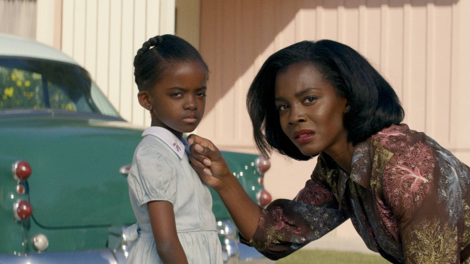 Melody Hurd and Deborah Ayorinde standing in a driveway in Them