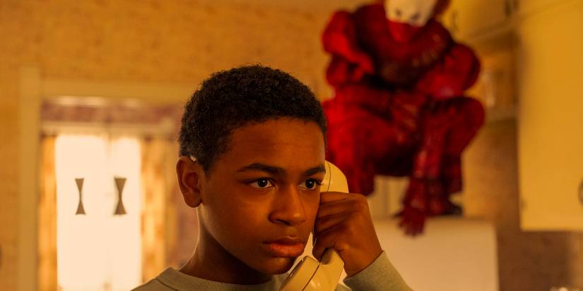 Will is on the phone while Pennywise is behind him in Welcome to Derry Ep. 7