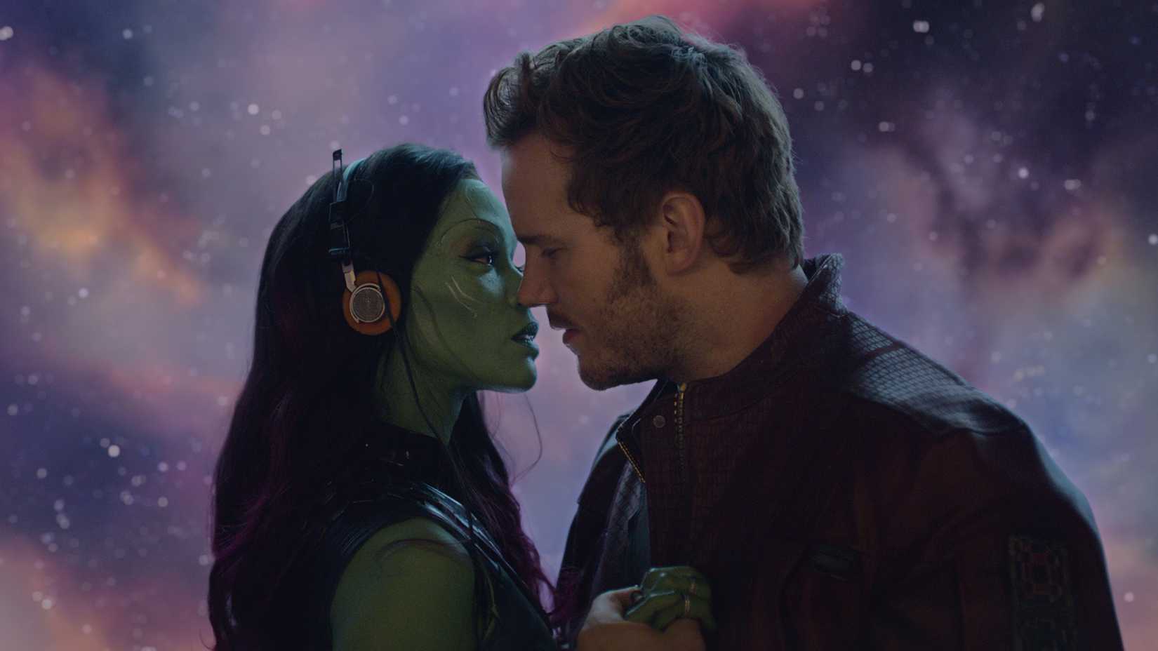 Zoe Saldana and Chris Pratt as Gamora and Peter listening to music together in Guardians of the Galaxy