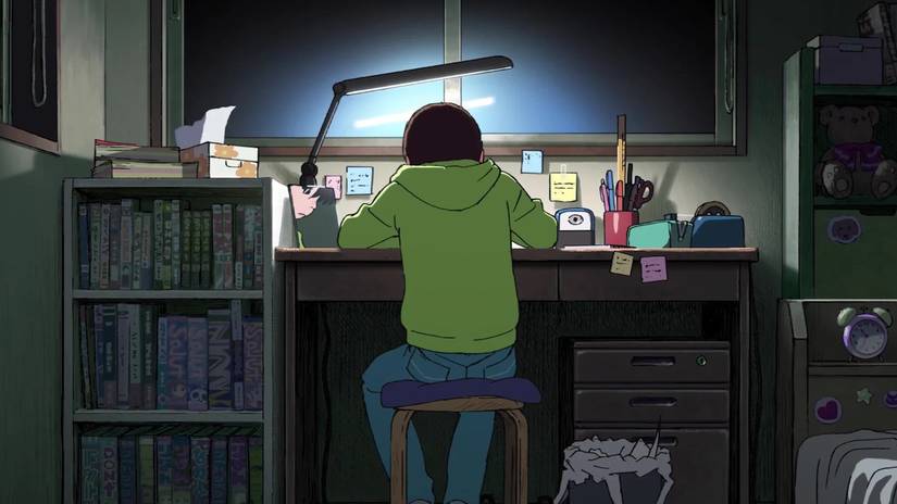 Fujino sitting at her desk in Look Back anime movie