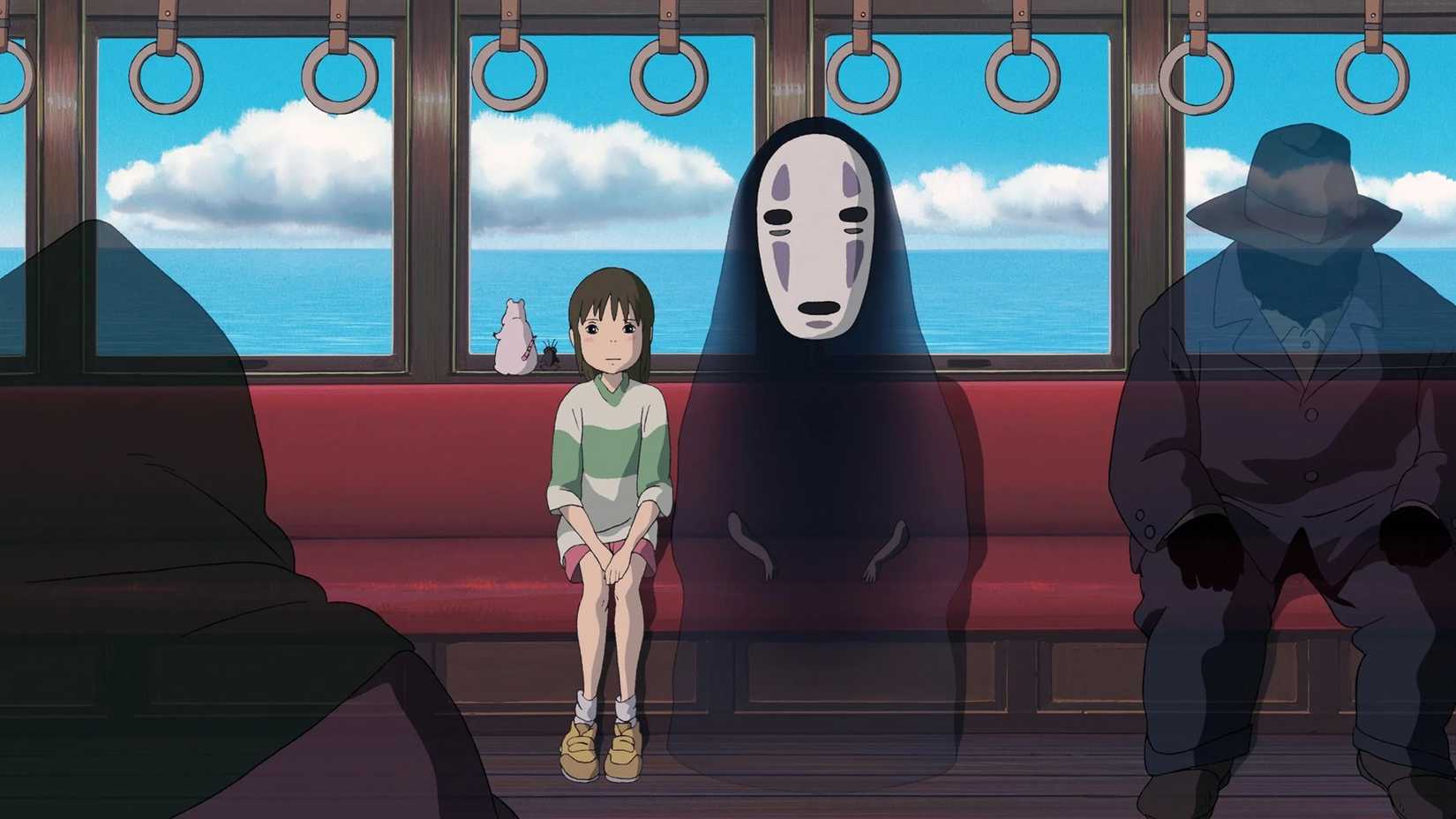 Chihiro and No-Face on a train in Studio Ghibli's Spirited Away.