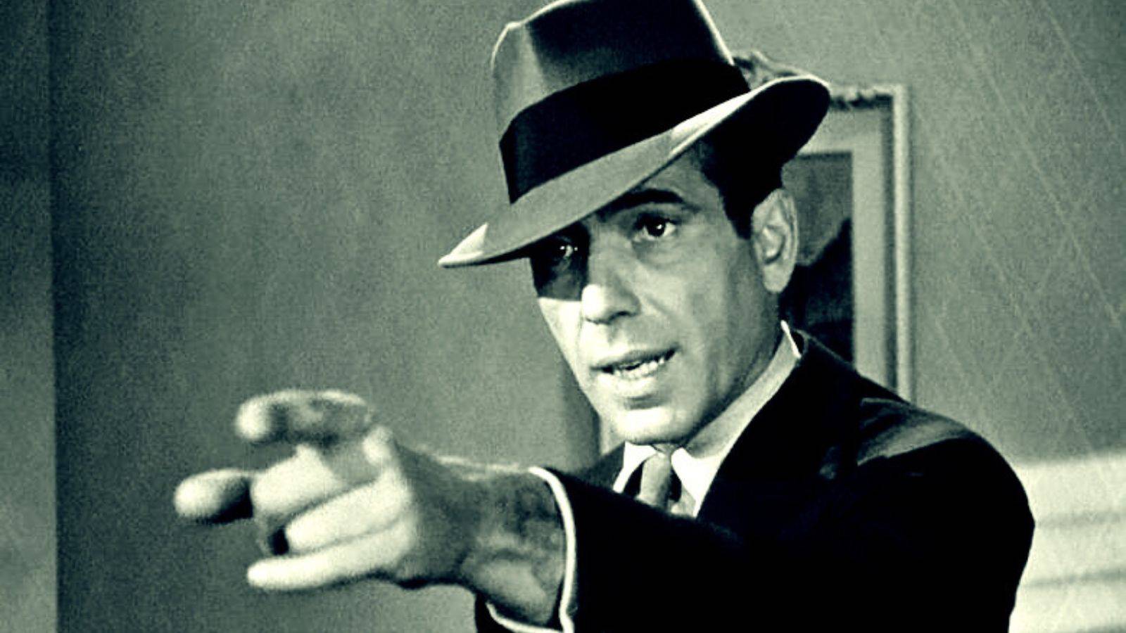 Sam Spade points sternly in The Maltese Falcon