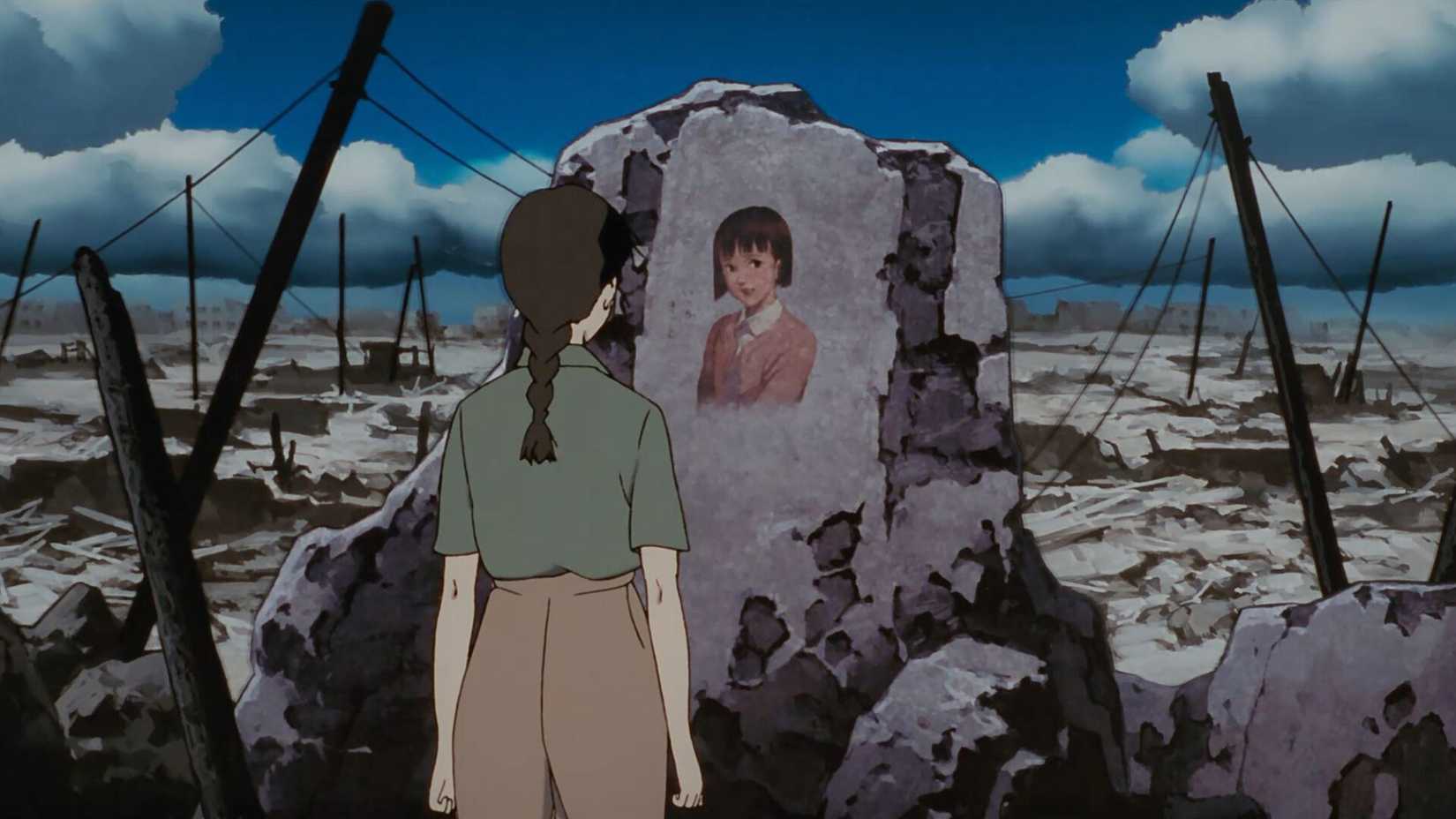 A young woman named Chiyoko Fujiwara looks at a painting of herself on the wall of a ruined building in Millennium Actress.