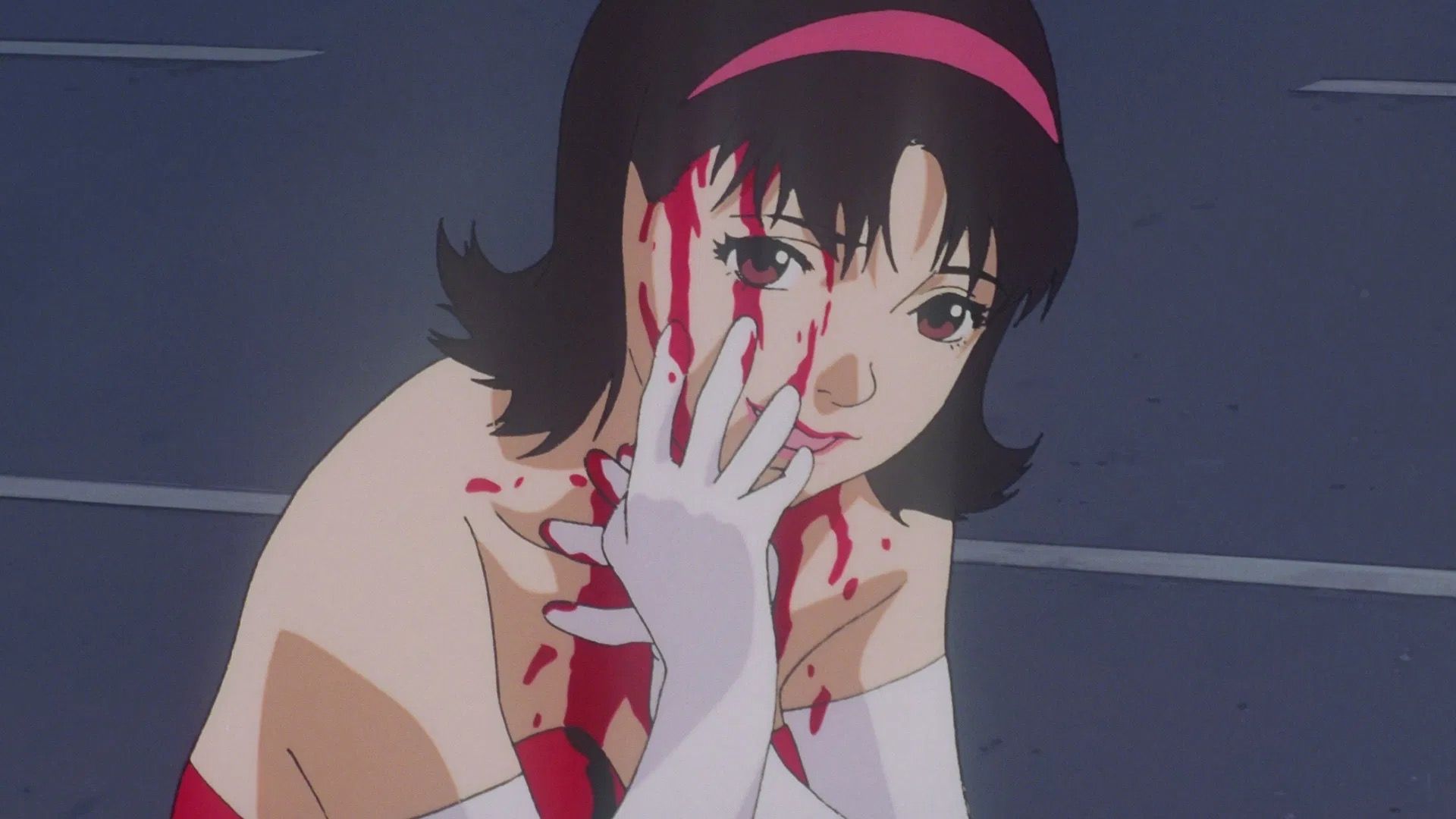 Pop idol Mima Kirigoe wipes blood on her face in Perfect Blue.