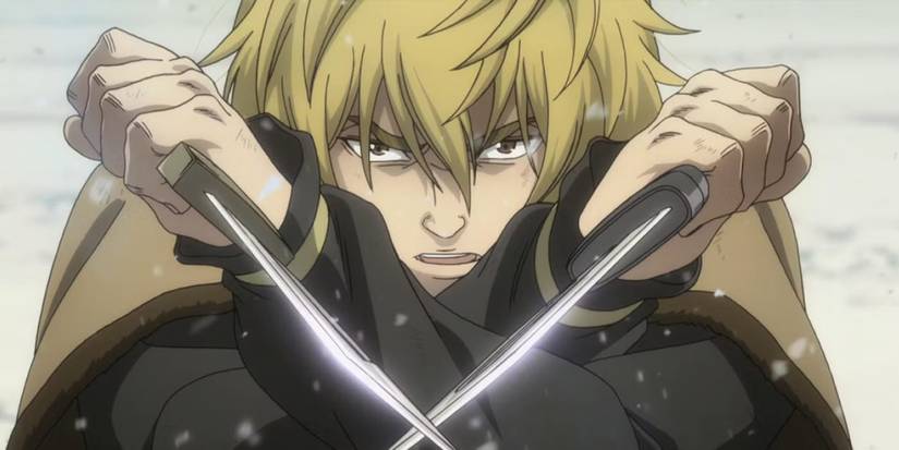 Thorfinn brandit deux couteaux dans la neige dans Vinland Saga