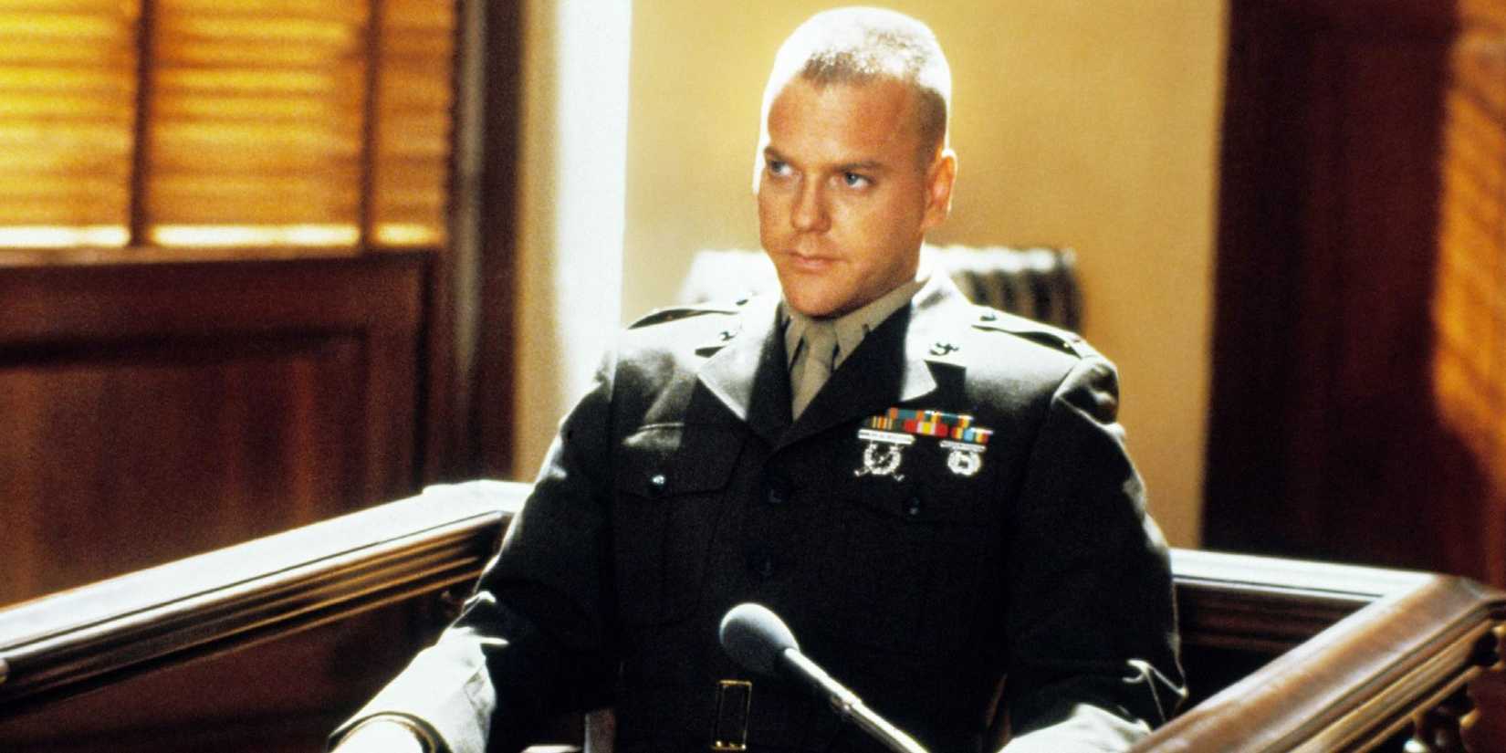 Kiefer Sutherland sitting in a uniform in court in A Few Good Men.