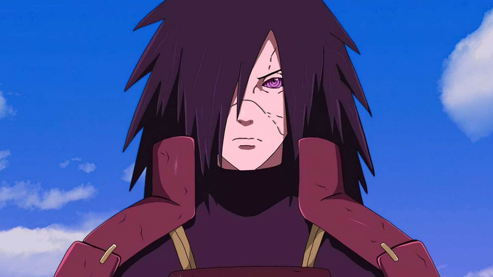 Madara Uchiha standing menacingly with a frown on his face as he activates the Rinnegan in Naruto Shipuuden