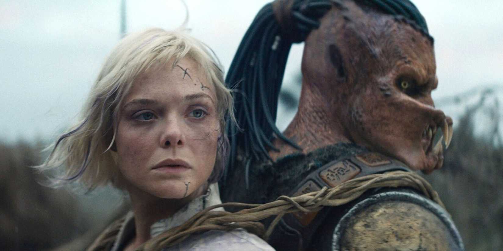 Thia strapped to Dek's back in Predator: Badlands.