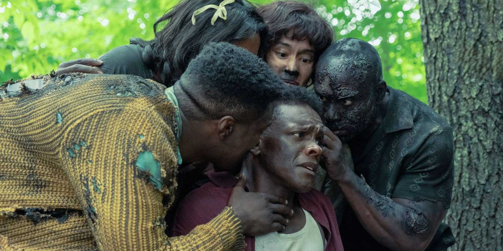 Dick surrounded by charred people in IT: Welcome to Derry.