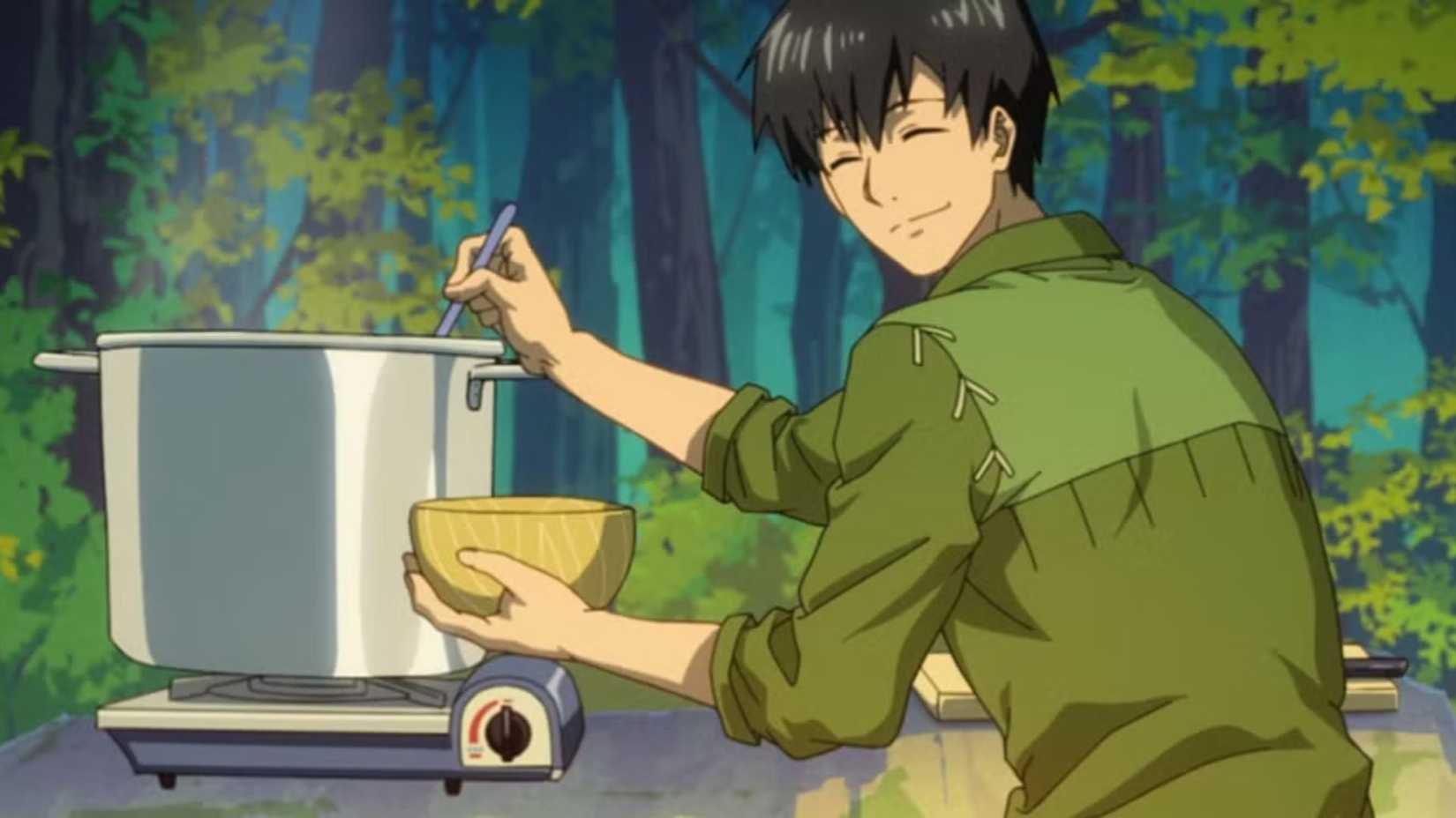 Campfire Cooking in Another World Tsuyoshi Mukouda smiles over his shoulder while cooking.