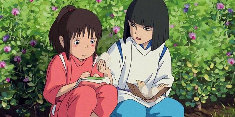 Chihiro and Haku sharing rice cakes in Studio Ghibli's Spirited Away