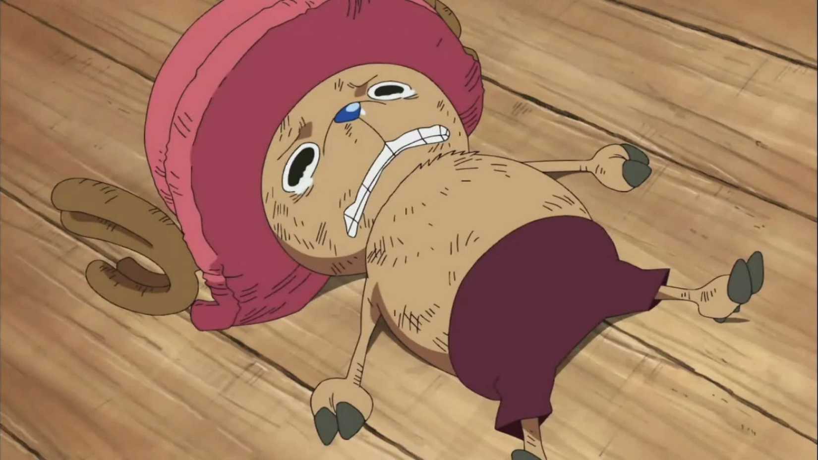 Chopper crying while lying down injured in One Piece
