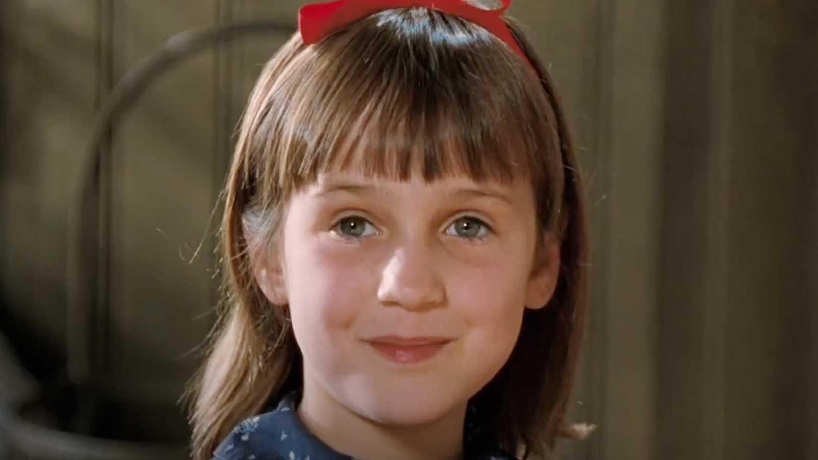 Matilda smiles with her red bow.