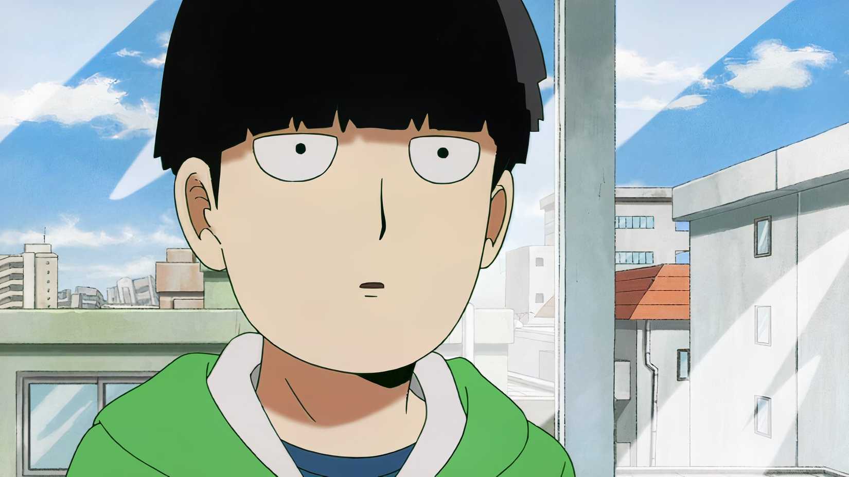 Mob from Mob Psycho 100 wears a green hoodie in front of a window