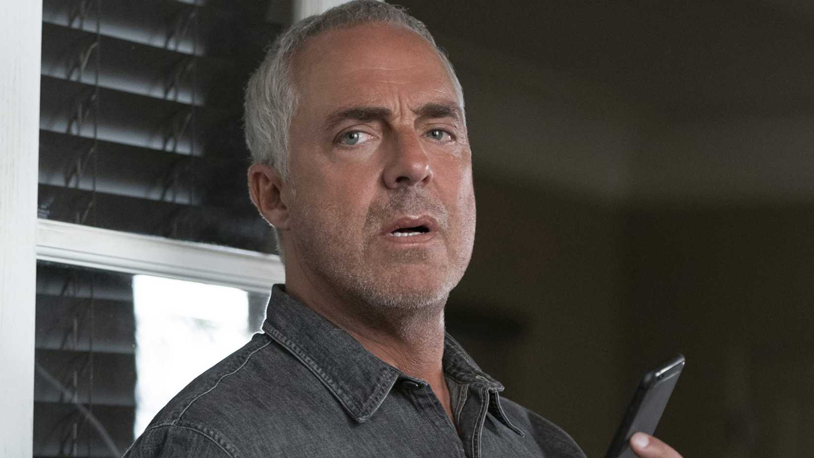 Titus Welliver talks on the phone in Bosch Legacy