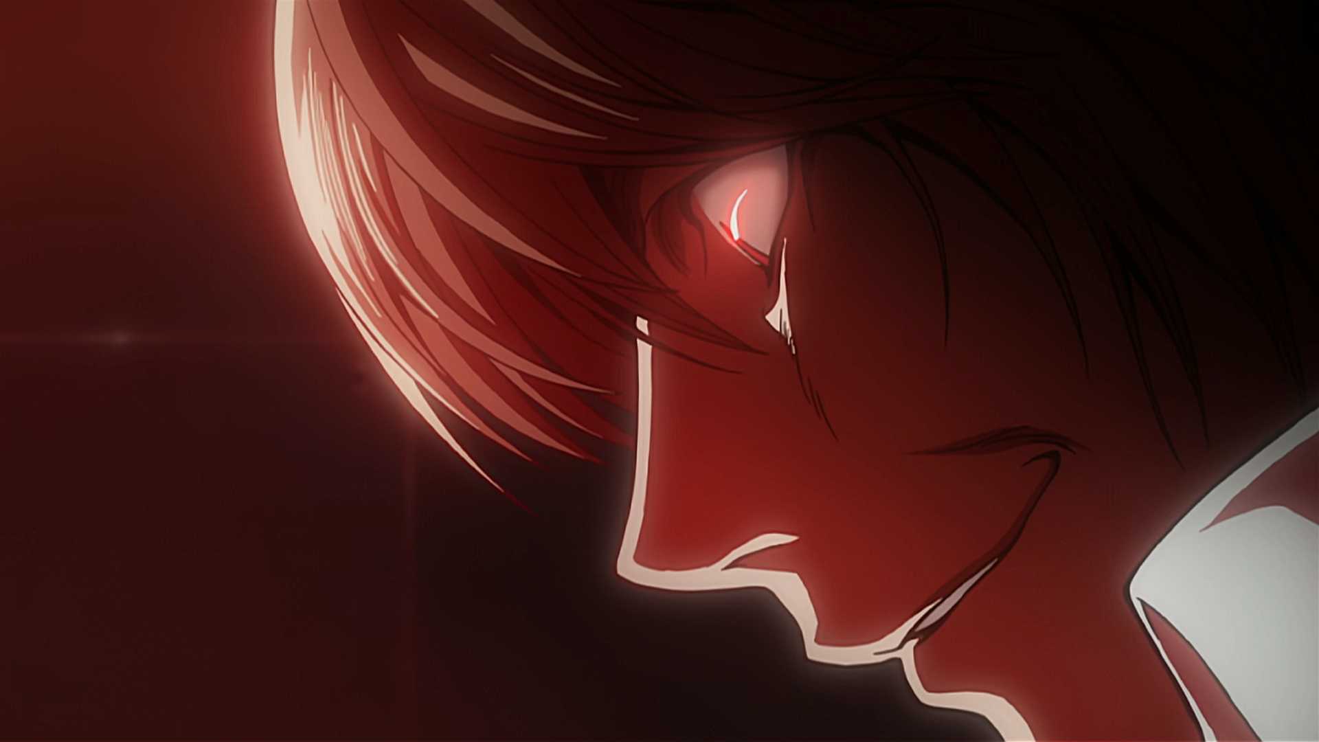 Light Yagami smiling as L dies in Death Note.