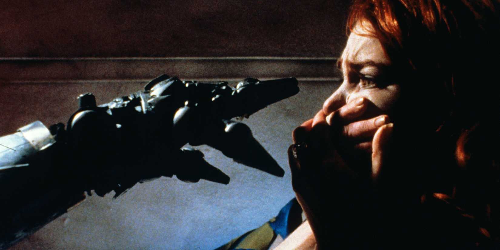 A hand reaching for a woman in Hardware