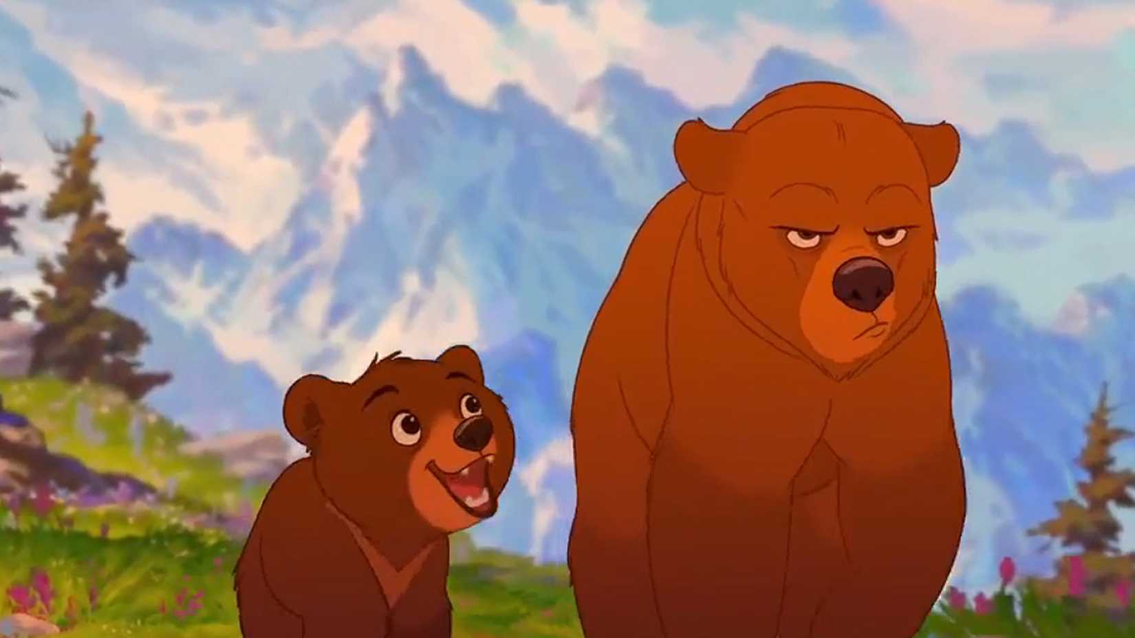 Kenai looks grumpy as Koda looks on in Brother Bear. 