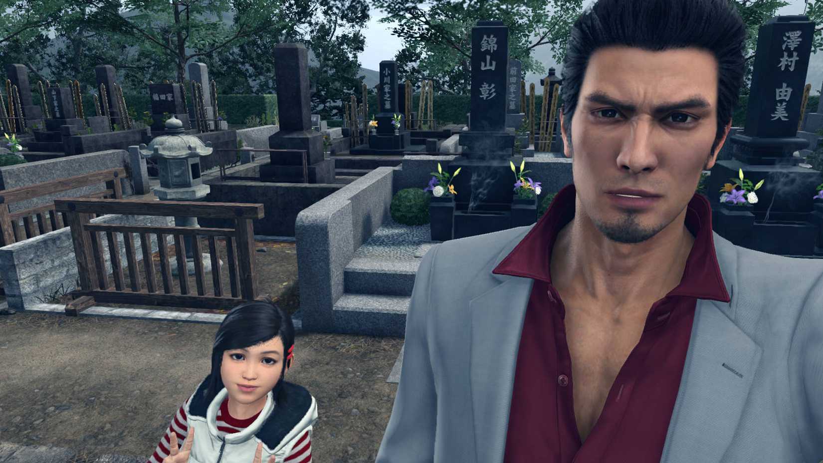 Haruka and Kiryu visiting family graves in Yakuza Kiwami 2