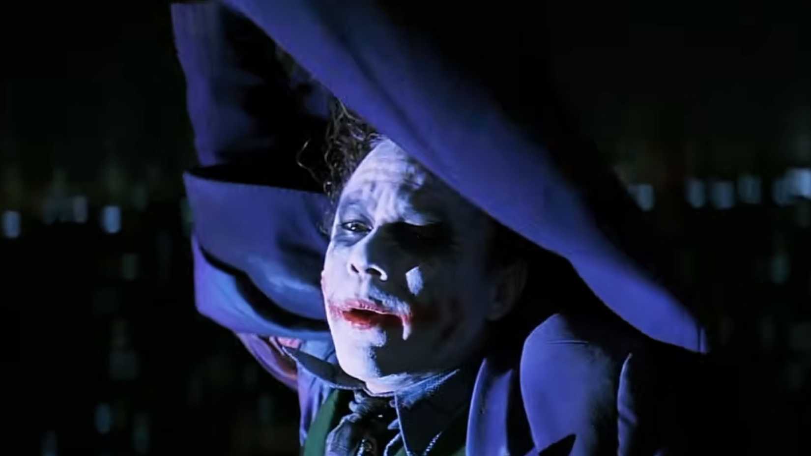 Heath Ledger as Joker hanging in The Dark Knight